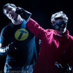 Photograph of Dr. Horrible punching Captain Hammer from Whedonesque Burlesque 2